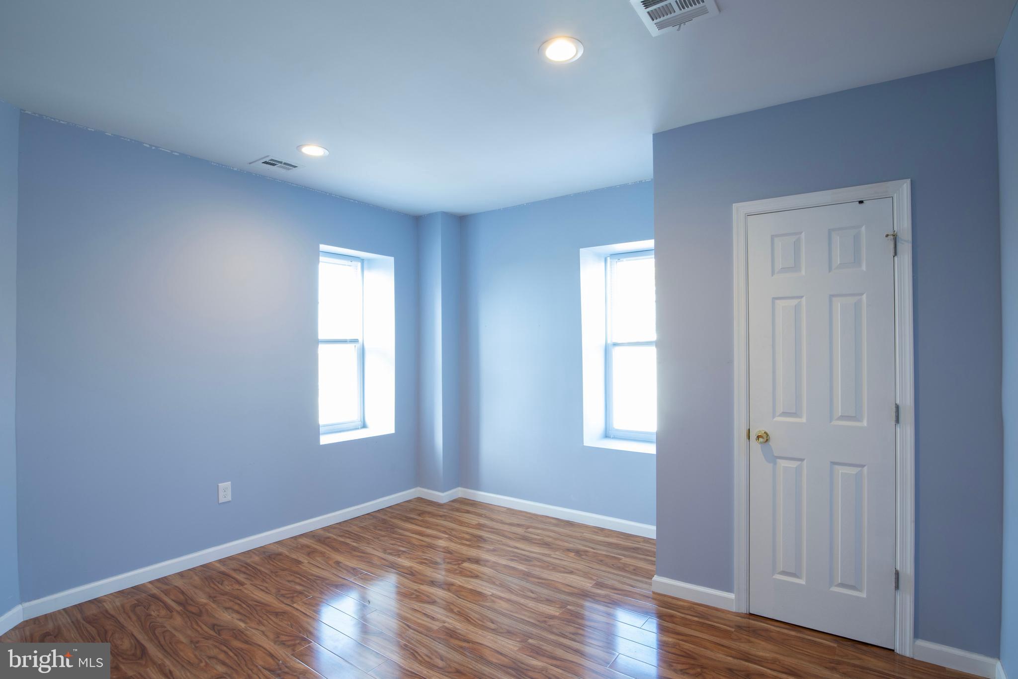 3350 Conrad Street, Unit A Philadelphia, PA 19129 - Photo 11 of 21 an empty room with wooden floor and windows