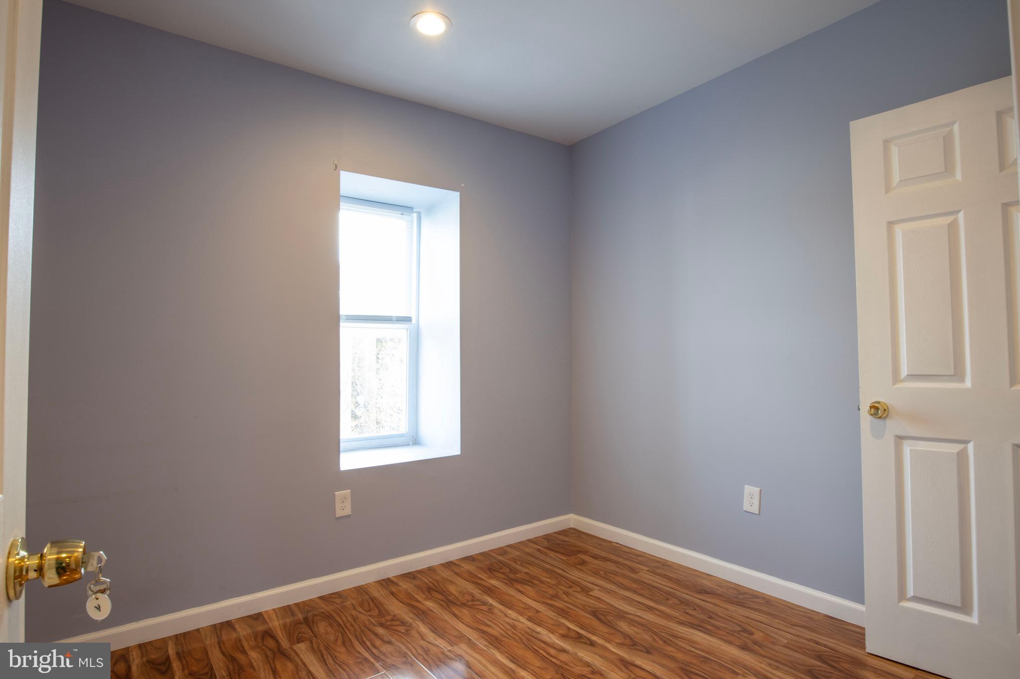 3350 Conrad Street, Unit A Philadelphia, PA 19129 - Photo 16 of 21 a view of an empty room with wooden floor and a window