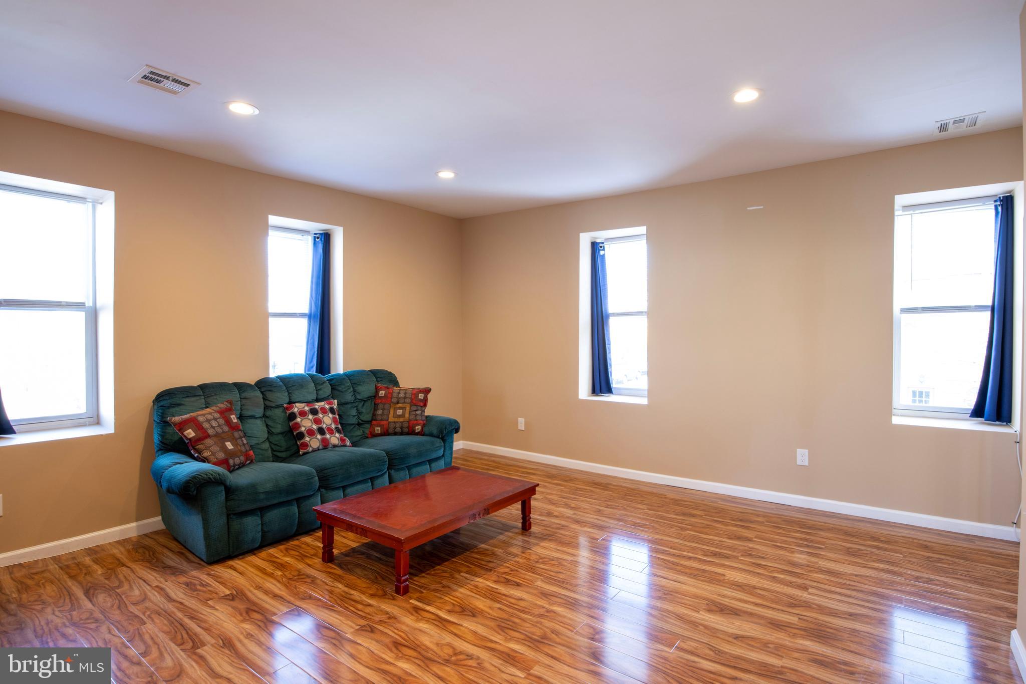 3350 Conrad Street, Unit A Philadelphia, PA 19129 - Photo 3 of 21 a living room with furniture and a wooden floor