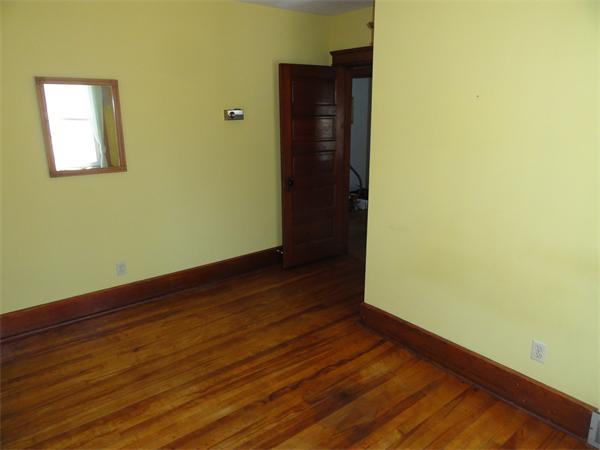 49 Glenwood Road Rutland, MA 01543 - Photo 9 of 21 a view of an empty room with wooden floor and a window