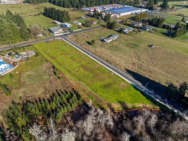 a view of a pool with chairs and yard