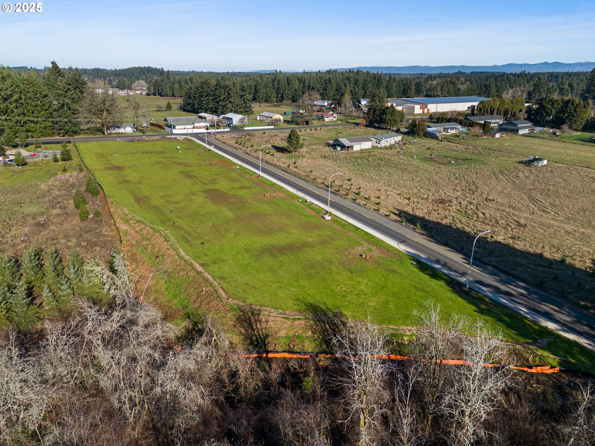 423 Kakela Road, Unit 8 Winlock, WA 98596 - Photo 15 of 35 a view of swimming pool with outdoor seating and trees in the background