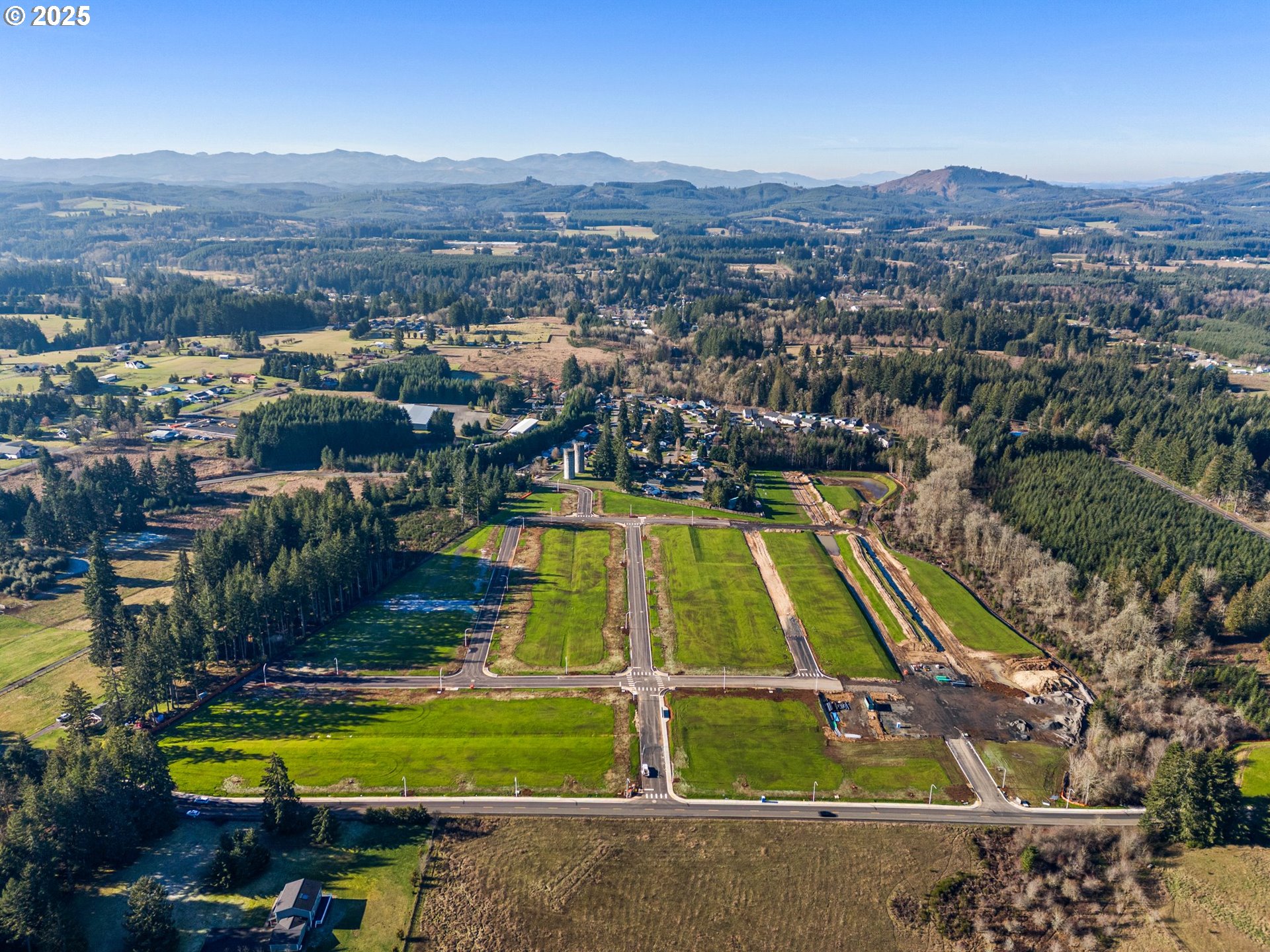 423 Kakela Road, Unit 8 Winlock, WA 98596 - Photo 10 of 35 an aerial view of residential houses with outdoor space and swimming pool