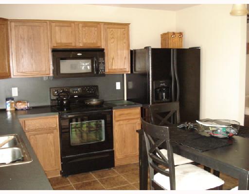 1001 Livermore Street Portland, TX 78374 - Photo 4 of 10 a kitchen with a refrigerator stove and sink