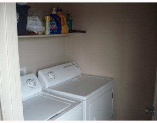 1001 Livermore Street Portland, TX 78374 - Photo 5 of 10 a utility room with dryer and washer