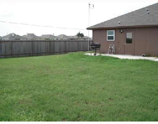 1001 Livermore Street Portland, TX 78374 - Photo 10 of 10 a backyard of a house with lots of green space