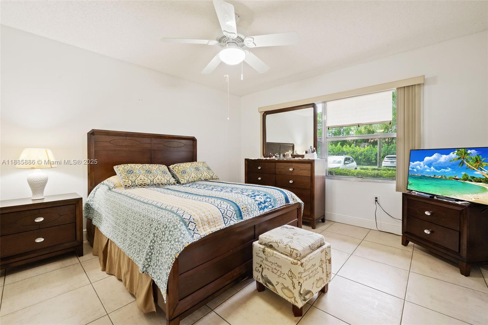701 Southwest 142nd Avenue, Unit 110S Pembroke Pines, FL 33027 - Photo 19 of 25 a bedroom with a bed and a couch