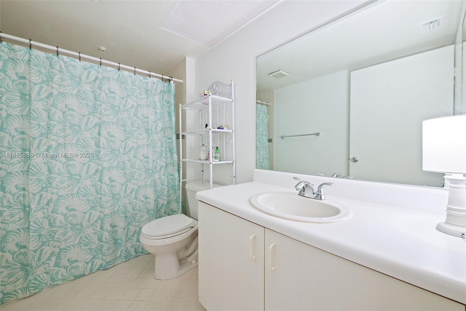 701 Southwest 142nd Avenue, Unit 110S Pembroke Pines, FL 33027 - Photo 21 of 25 a bathroom with a sink a toilet and shower