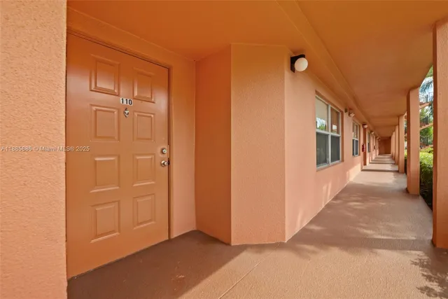 a view of a hallway with wooden shelves