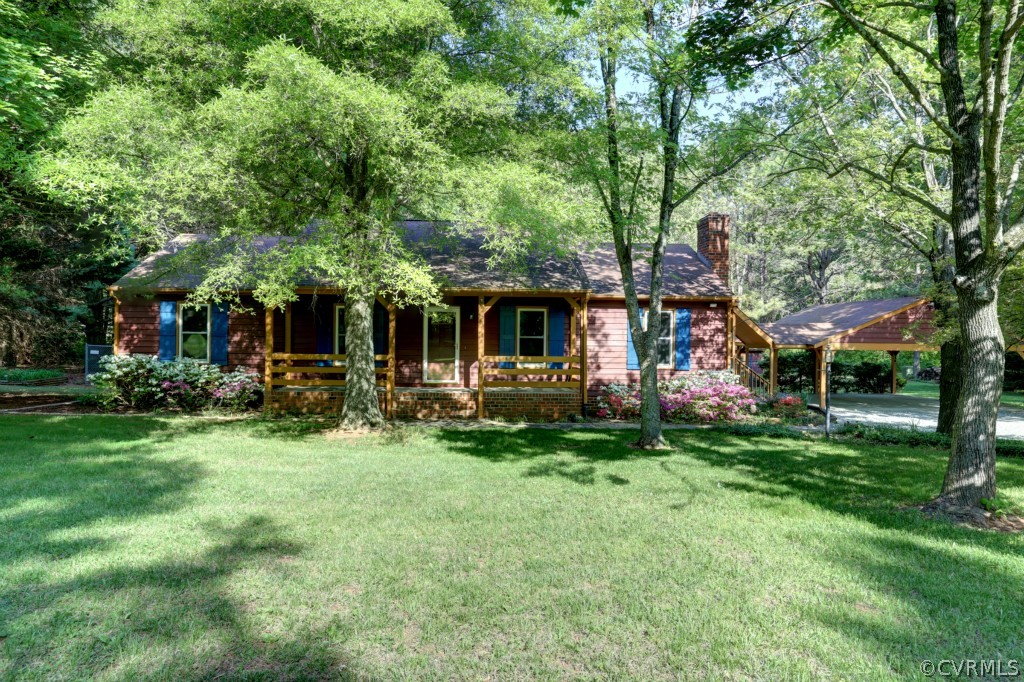 2220 Shallow Well Road Manakin-Sabot, VA 23103 - Photo 1 of 23 a front view of a house with a garden