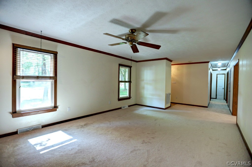 2220 Shallow Well Road Manakin-Sabot, VA 23103 - Photo 13 of 23 an empty room with windows and fan
