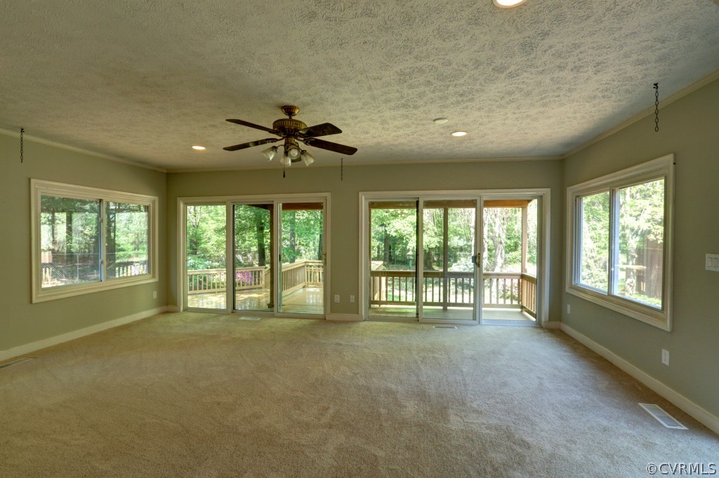 2220 Shallow Well Road Manakin-Sabot, VA 23103 - Photo 16 of 23 a view of an empty room with a fireplace and a large window
