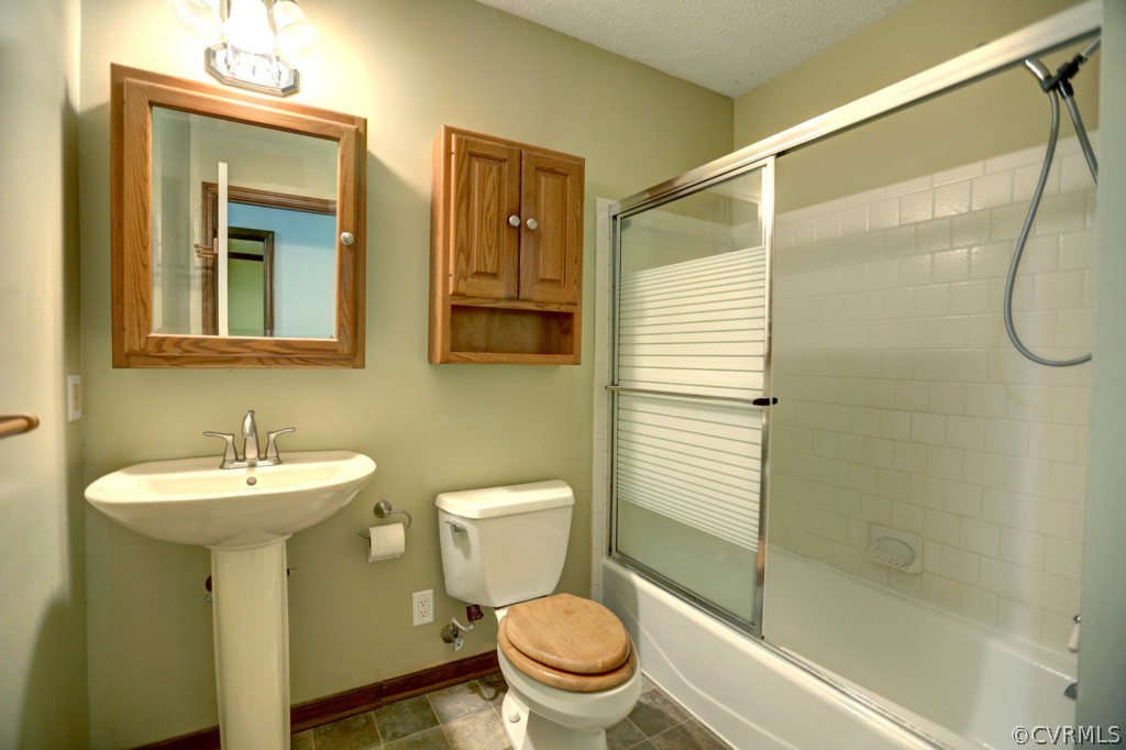 2220 Shallow Well Road Manakin-Sabot, VA 23103 - Photo 22 of 23 a bathroom with a sink toilet and shower
