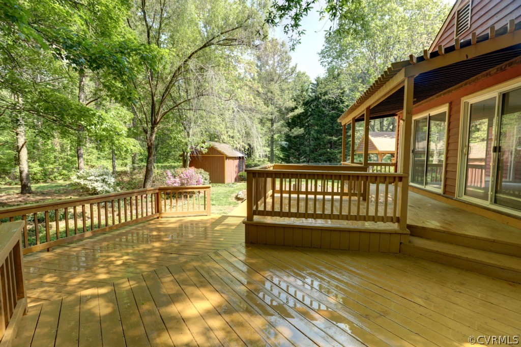 2220 Shallow Well Road Manakin-Sabot, VA 23103 - Photo 5 of 23 a view of a roof deck with wooden floor and fence