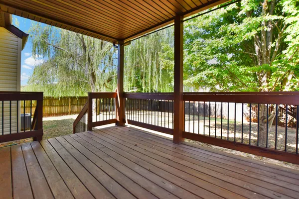 a view of porch with wooden floor