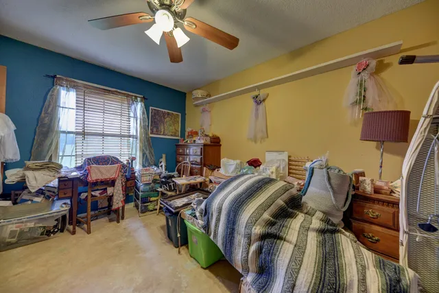 a bed room with a bed and a window