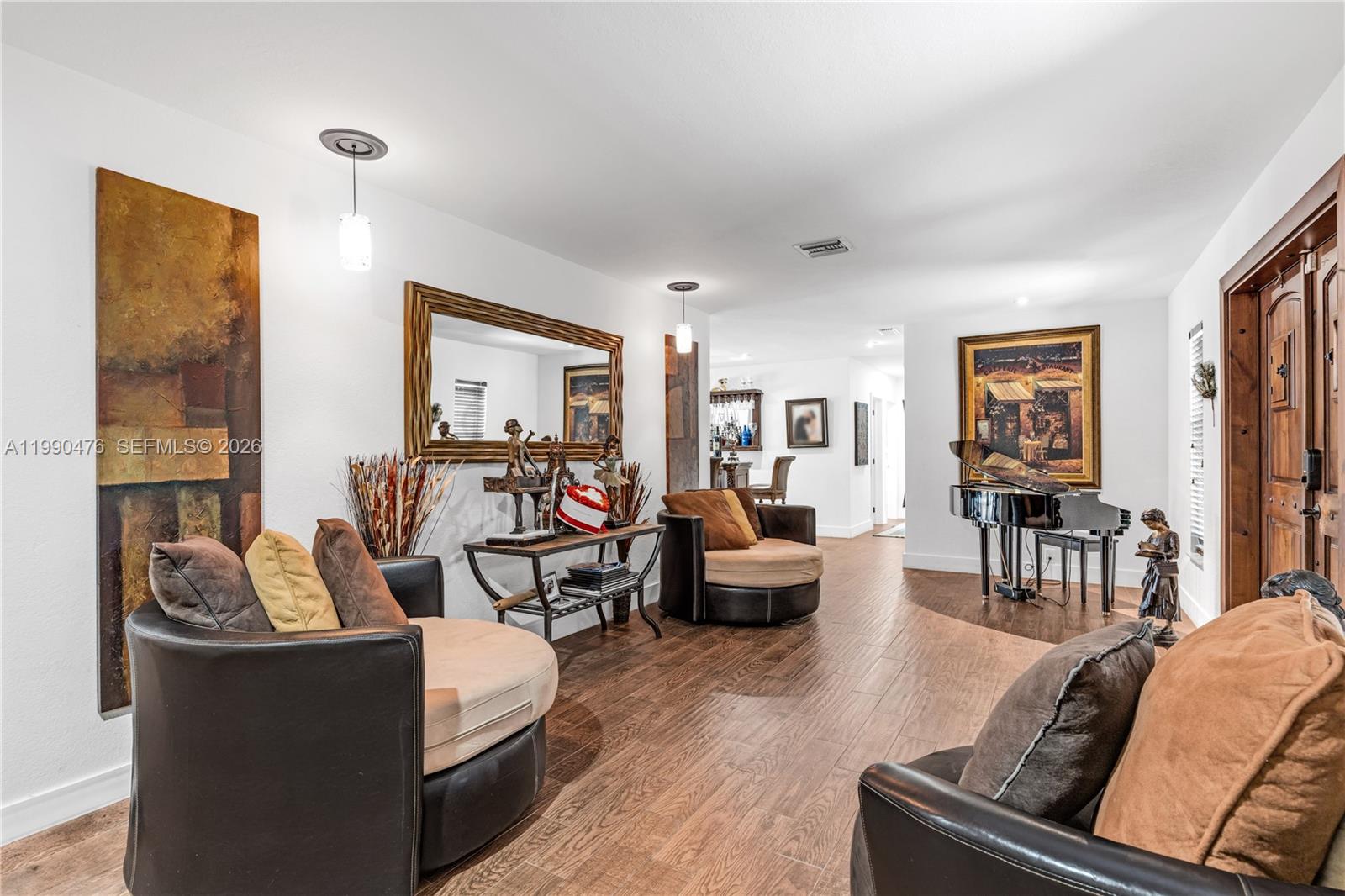 18851 Southwest 218th Street Miami, FL 33170 - Photo 5 of 27 a living room with furniture and a large window