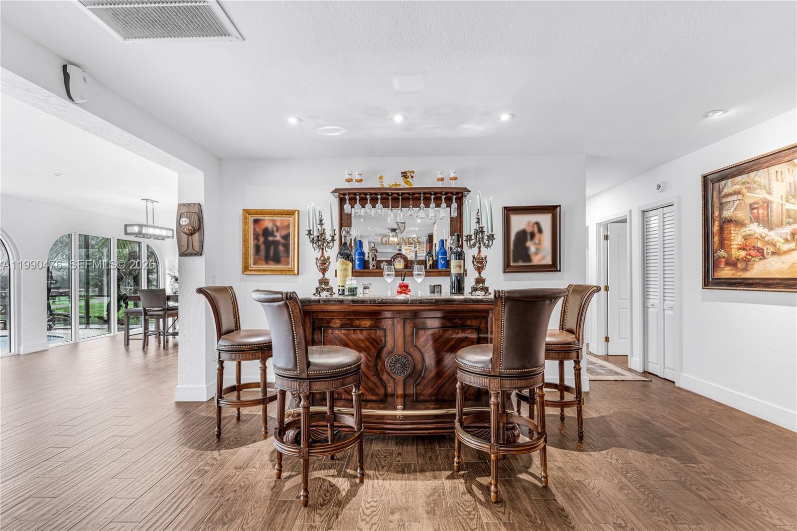 18851 Southwest 218th Street Miami, FL 33170 - Photo 6 of 27 a view of a dining room with furniture and wooden floor