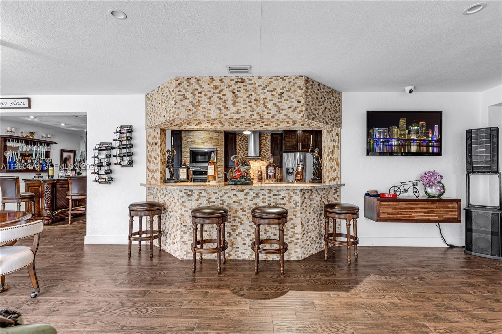 18851 Southwest 218th Street Miami, FL 33170 - Photo 9 of 27 a living room with furniture and a flat screen tv