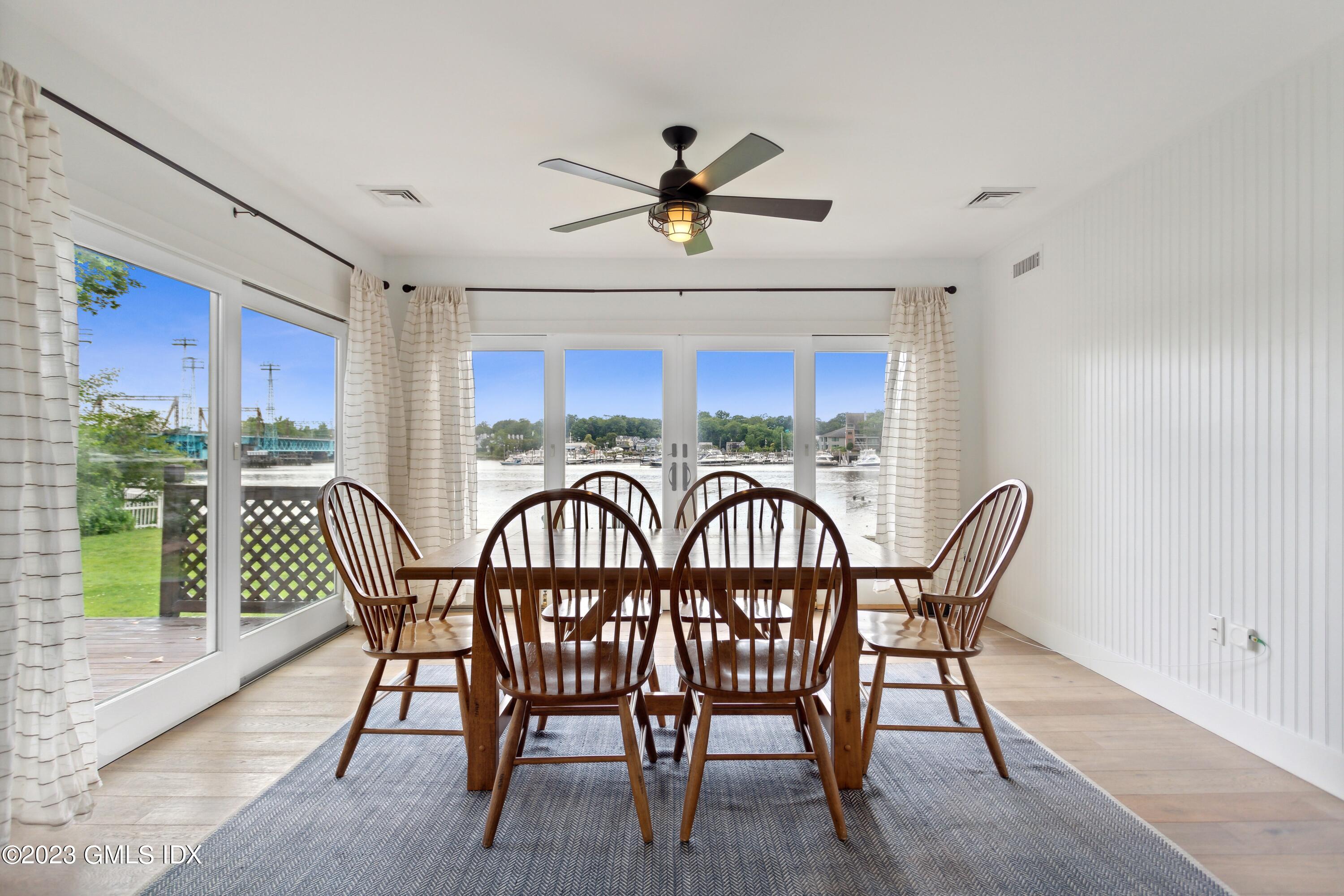 40 Chapel Lane Riverside, CT 06878 - Photo 17 of 35 a view of a dining room with furniture window and wooden floor