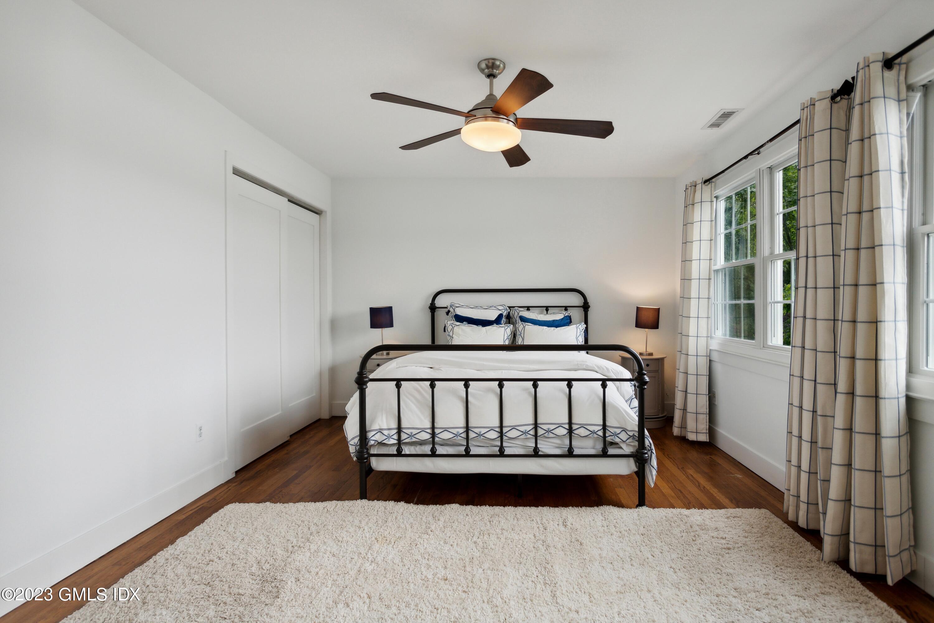 40 Chapel Lane Riverside, CT 06878 - Photo 18 of 35 a bedroom with a bed and window