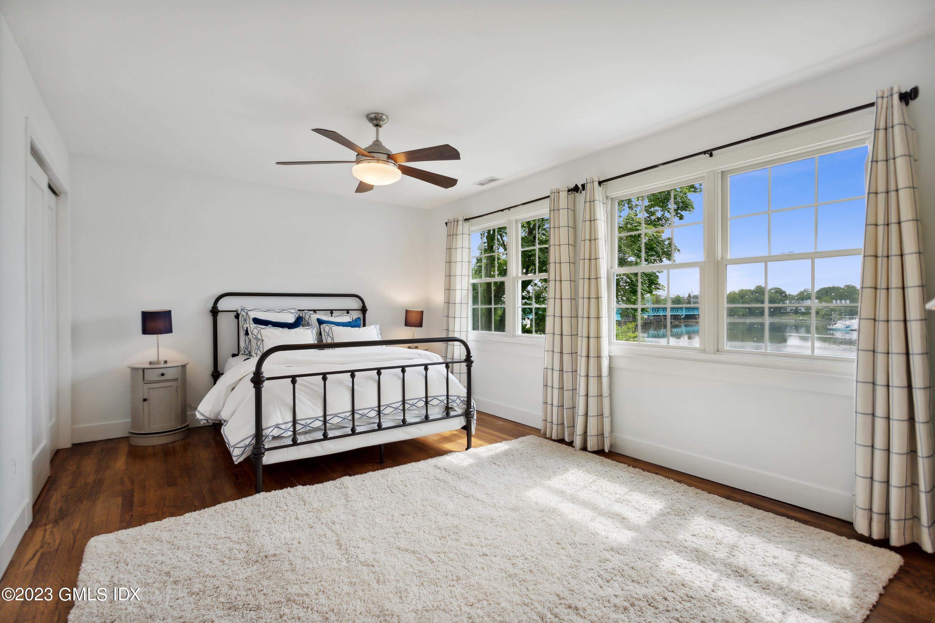 40 Chapel Lane Riverside, CT 06878 - Photo 19 of 35 a bedroom with a bed and window