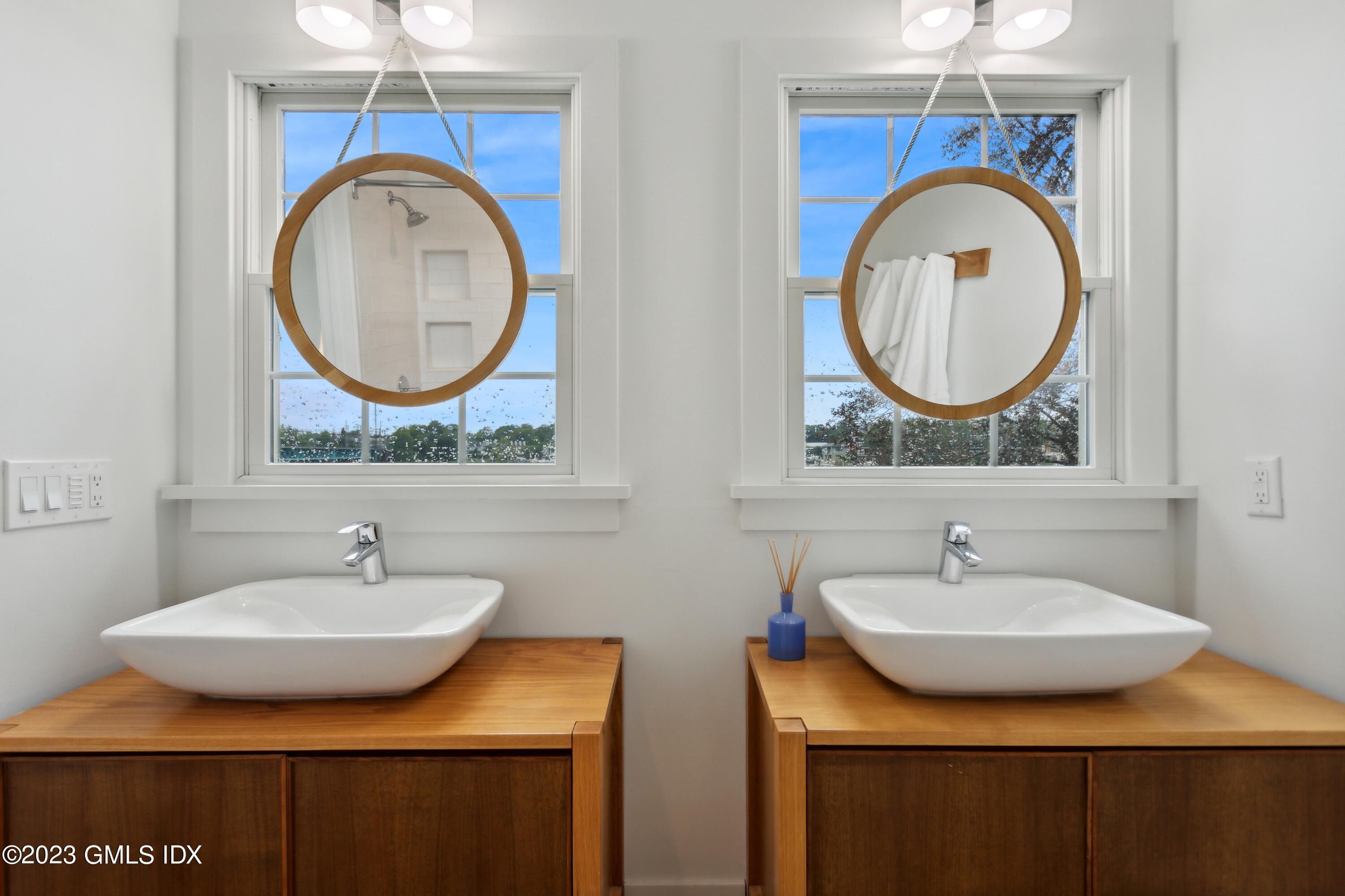 40 Chapel Lane Riverside, CT 06878 - Photo 22 of 35 a bathroom with a sink and a mirror
