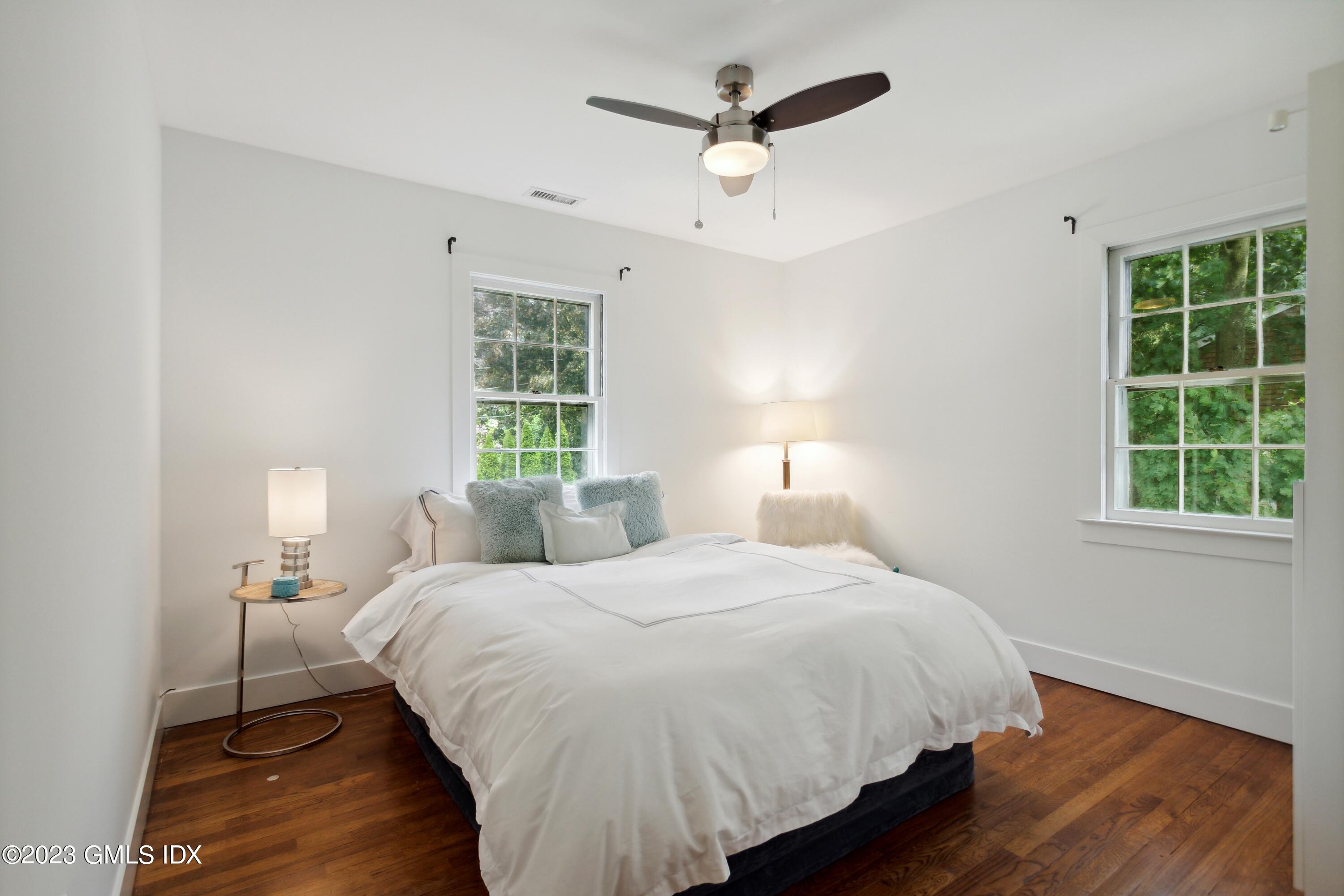 40 Chapel Lane Riverside, CT 06878 - Photo 23 of 35 a bedroom with a large bed and a window