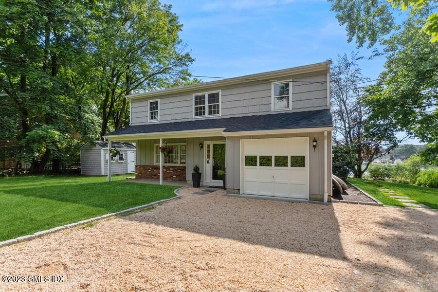 40 Chapel Lane Riverside, CT 06878 - Photo 3 of 35 a view of a house with a yard and potted plants