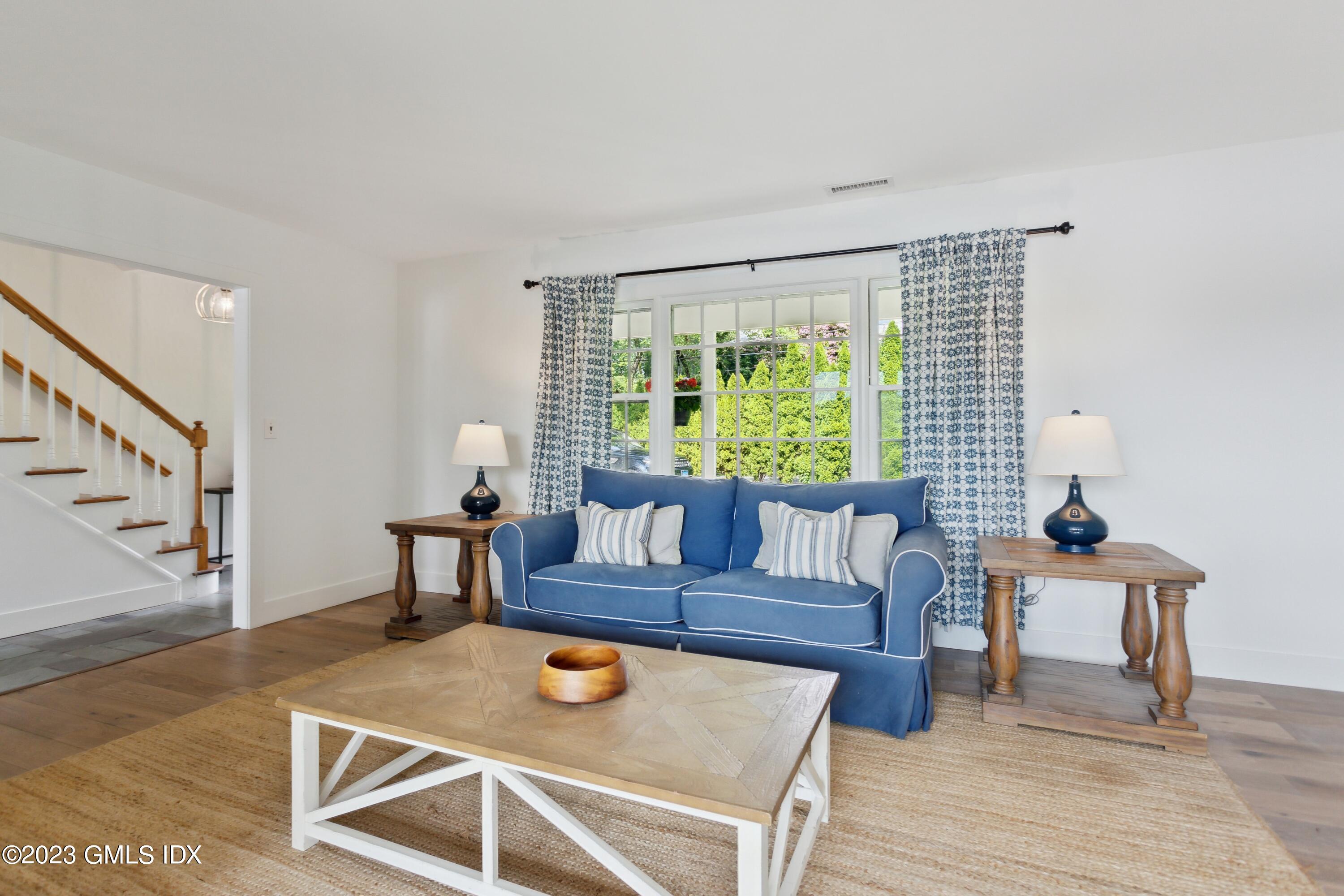 40 Chapel Lane Riverside, CT 06878 - Photo 8 of 35 a living room with furniture and a large window