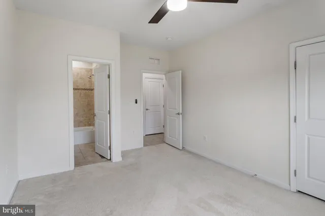 an empty room with a bathroom