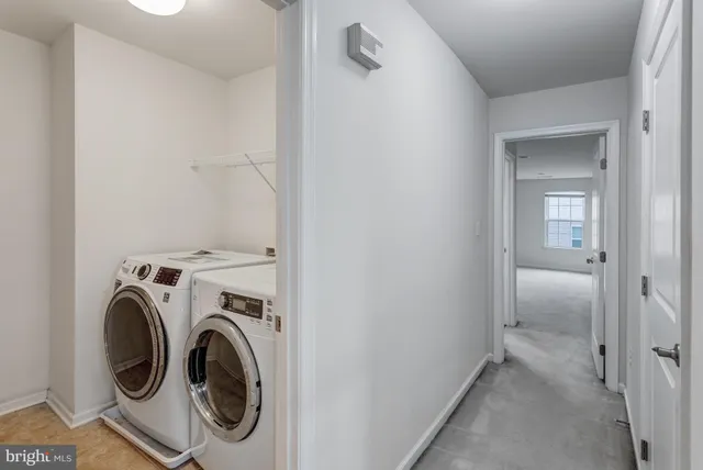 a view of a storage & utility room with washer and dryer