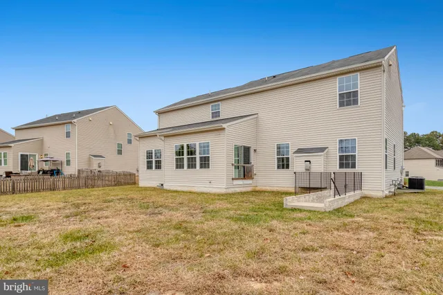 a big house with swimming pool in front of it
