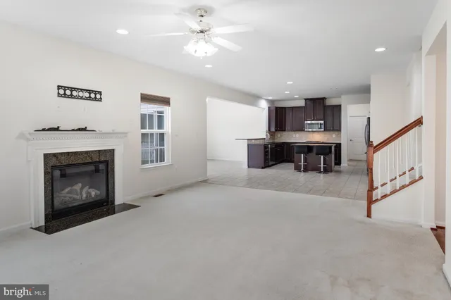 a view of a livingroom with furniture and a fireplace