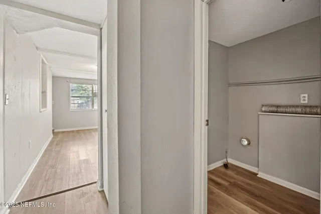 a bedroom with double bed and a chandelier
