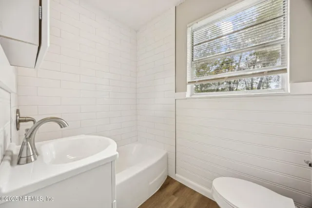 a view of room with window and ceiling fan