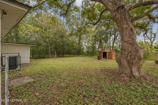 a backyard of a house with lots of green space