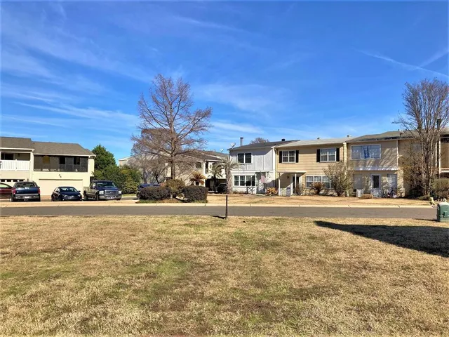 a view of a lake with a building in the background