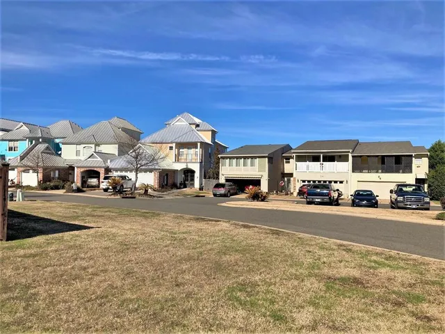a view of swimming pool with outdoor seating and city view