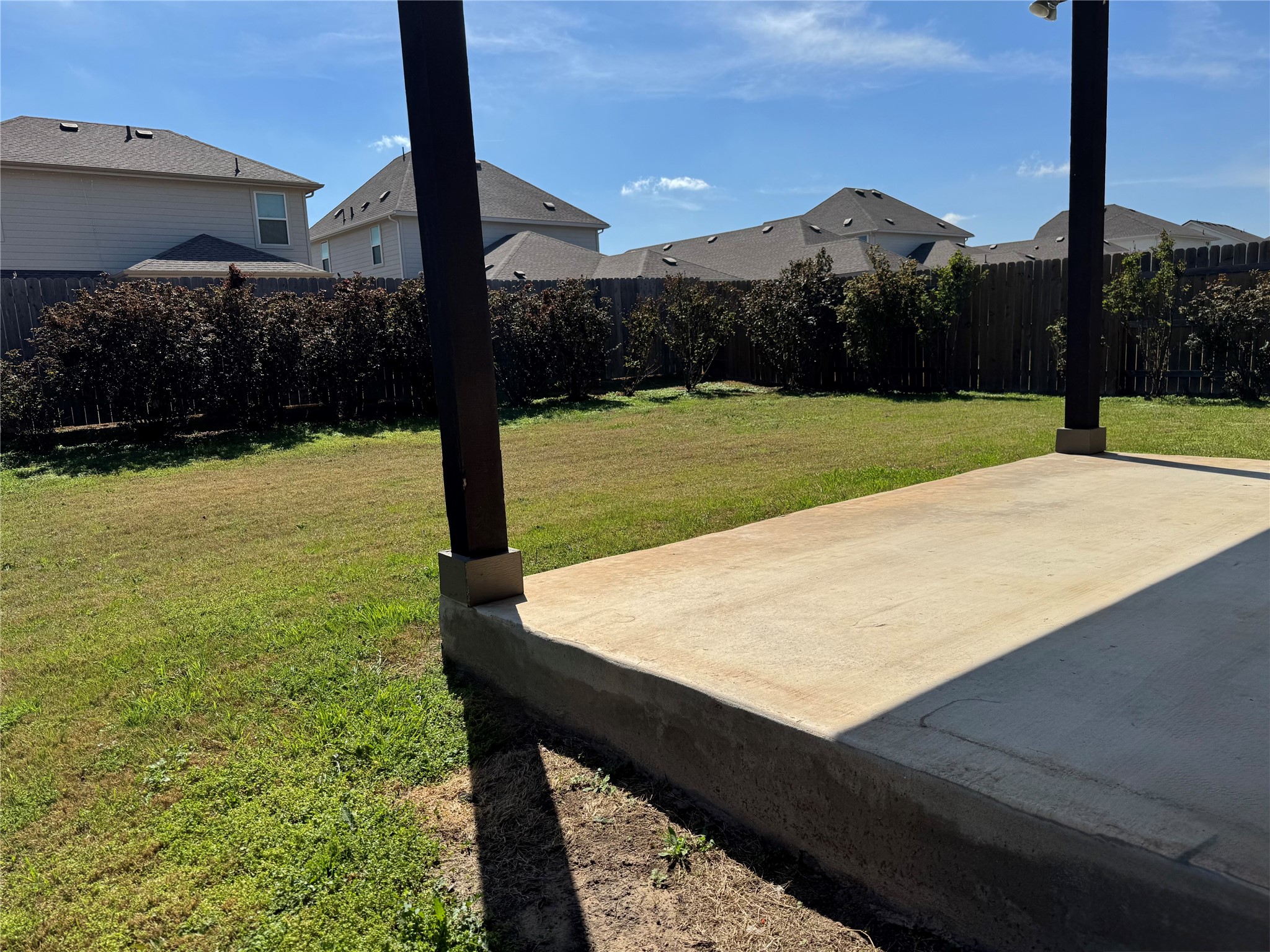 623 Pheasant Hill Lane Georgetown, TX 78628 - Photo 15 of 17 Fenced backyard featuring a residential view and a patio area