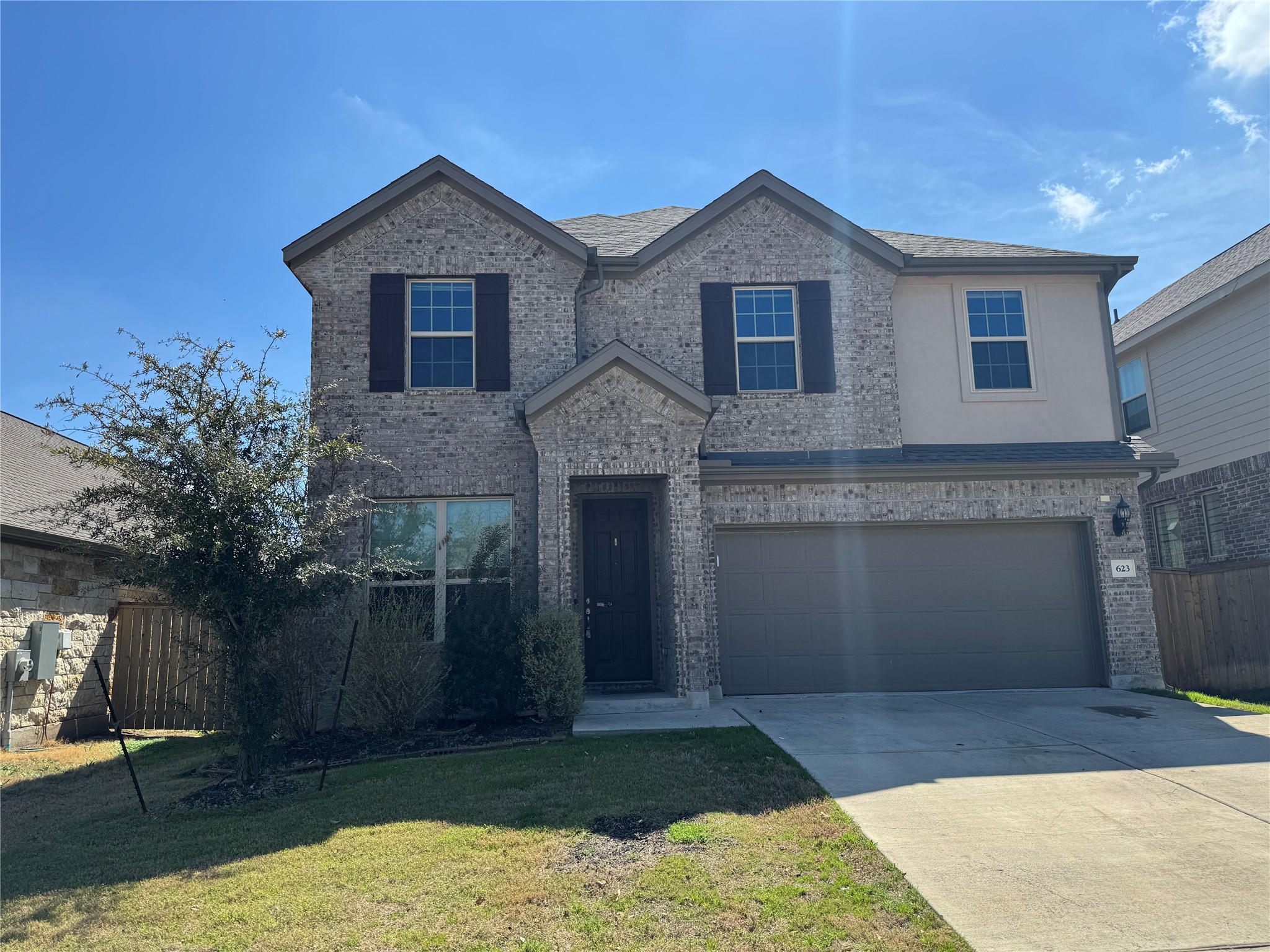 623 Pheasant Hill Lane Georgetown, TX 78628 - Photo 3 of 17 Traditional home featuring concrete driveway, an attached garage, and brick siding