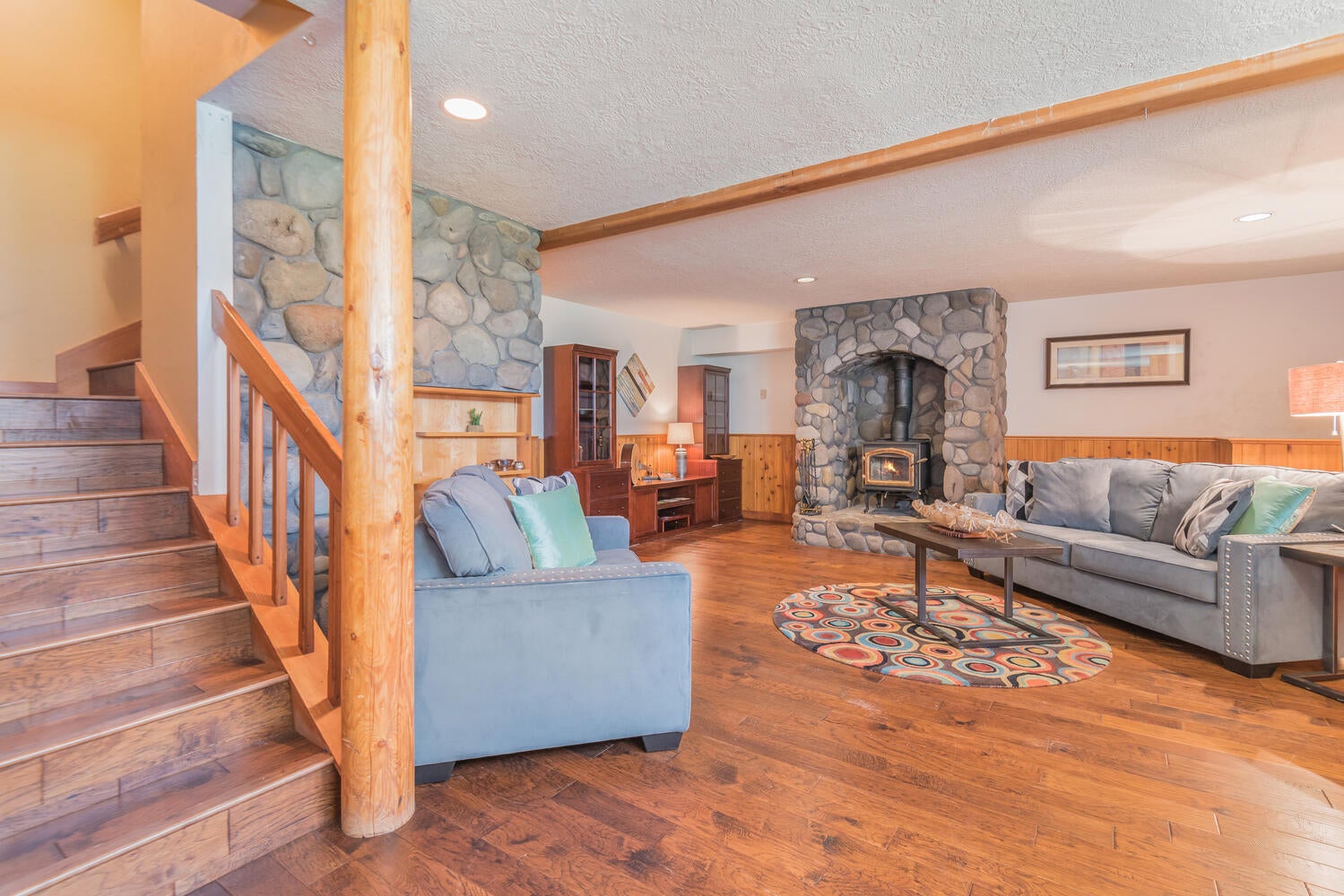 67895 Peterson Burn Road Sisters, OR 97759 - Photo 27 of 63 Lower level family room and fireplace