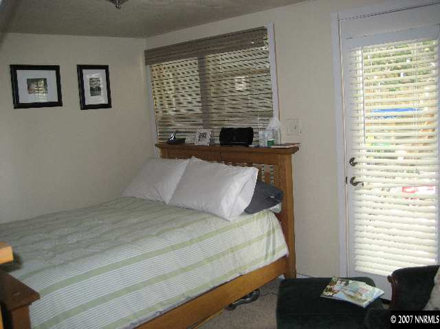 950 Williams Avenue Reno, NV 89503 - Photo 6 of 9 a bedroom with a bed and a window