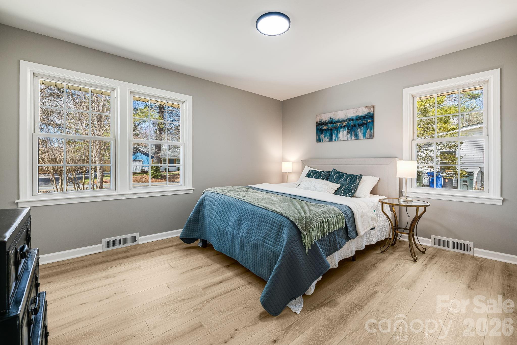 107 Balsam Road Hendersonville, NC 28792 - Photo 21 of 44 a bedroom with a bed and a window