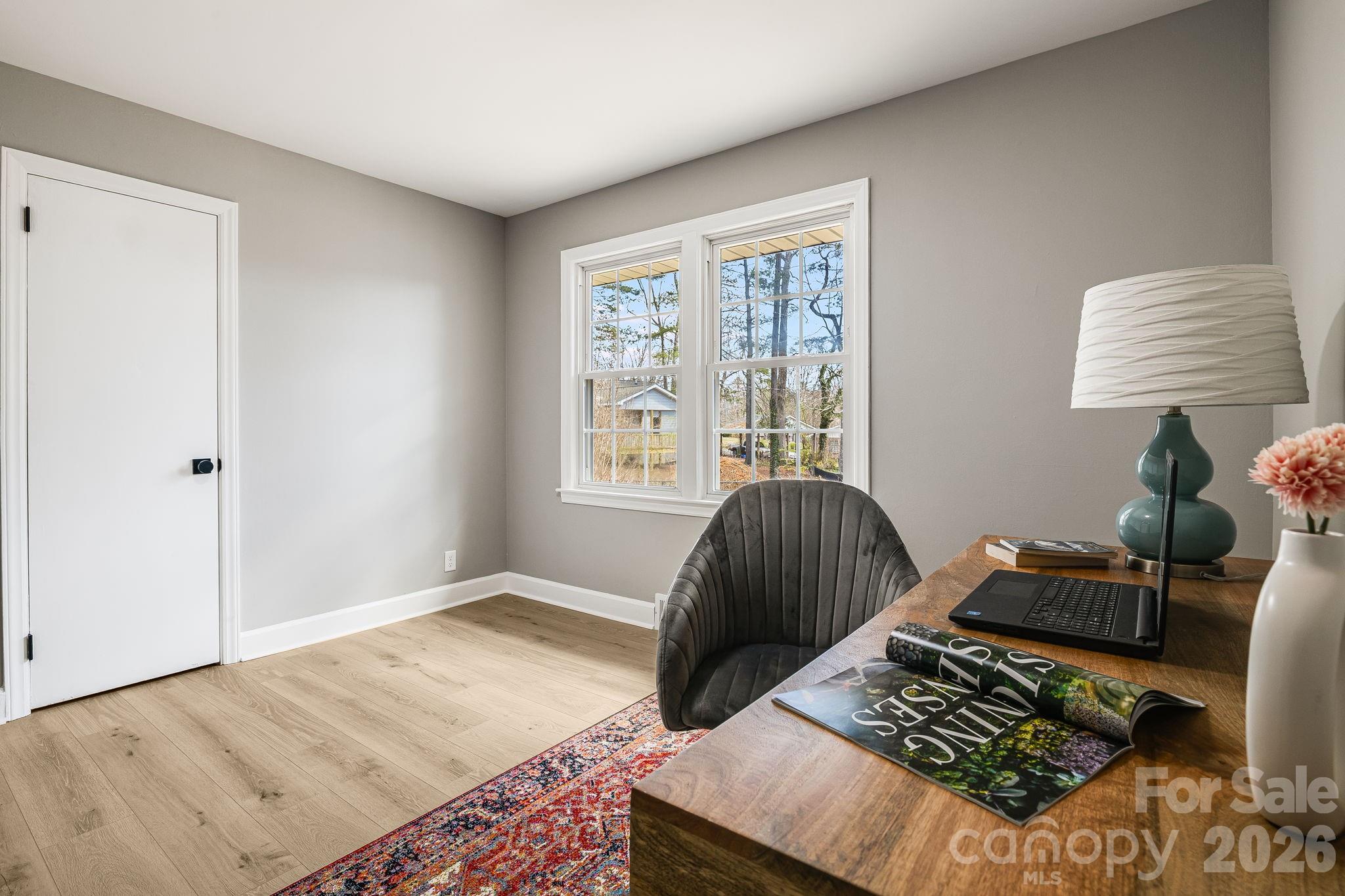107 Balsam Road Hendersonville, NC 28792 - Photo 24 of 44 a bedroom with two beds and a window