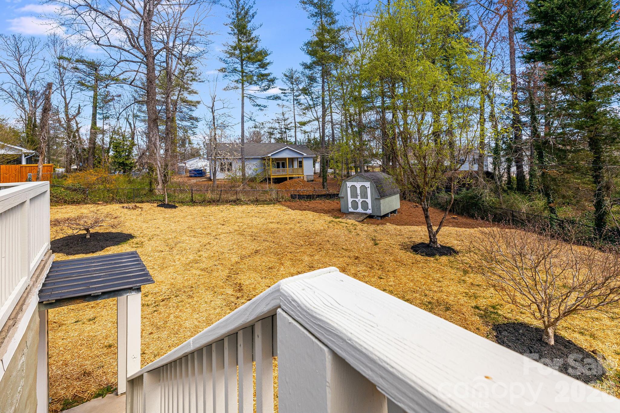 107 Balsam Road Hendersonville, NC 28792 - Photo 36 of 44 a view of a yard with yellow house