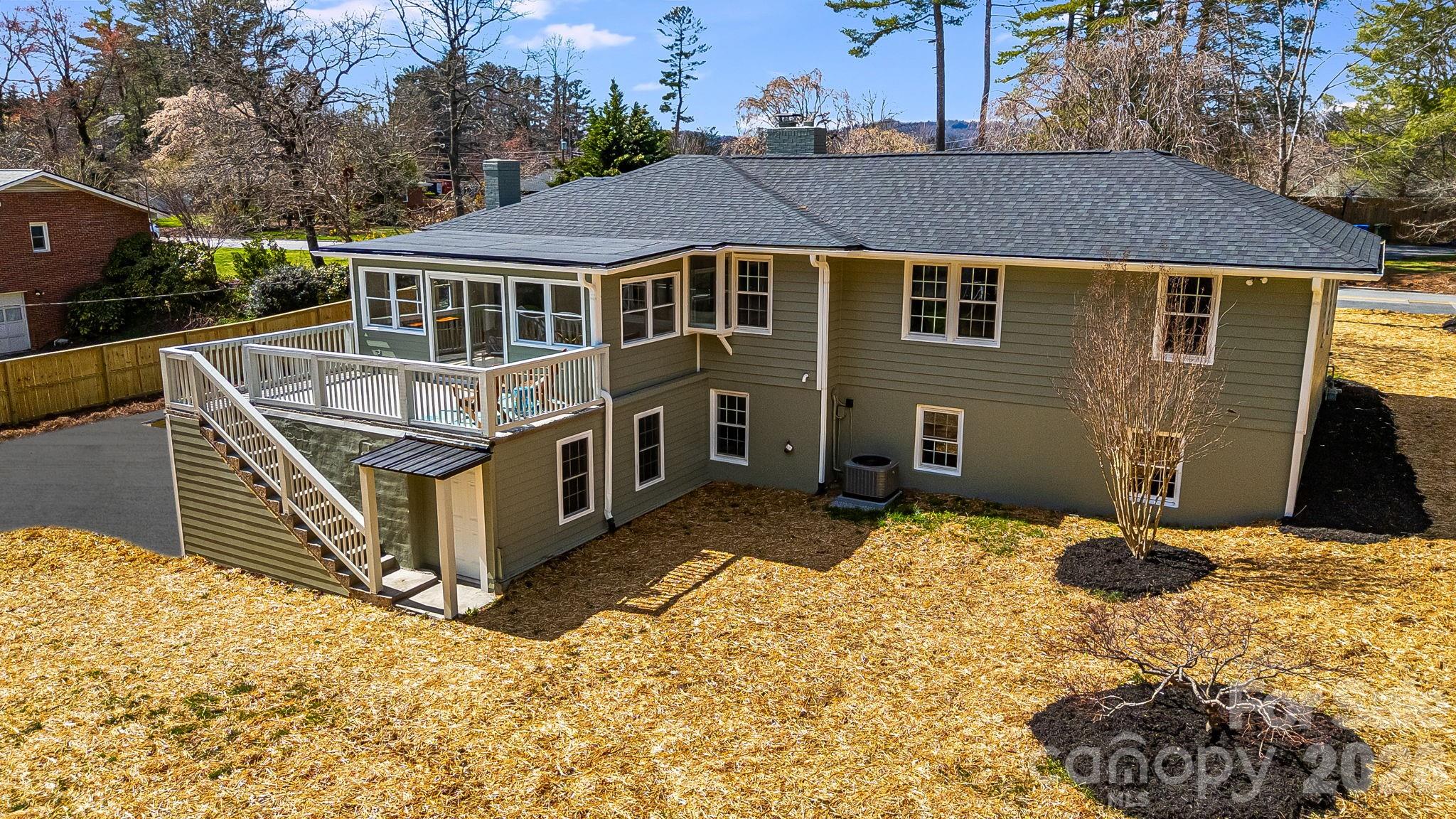 107 Balsam Road Hendersonville, NC 28792 - Photo 37 of 44 a aerial view of a house with a yard