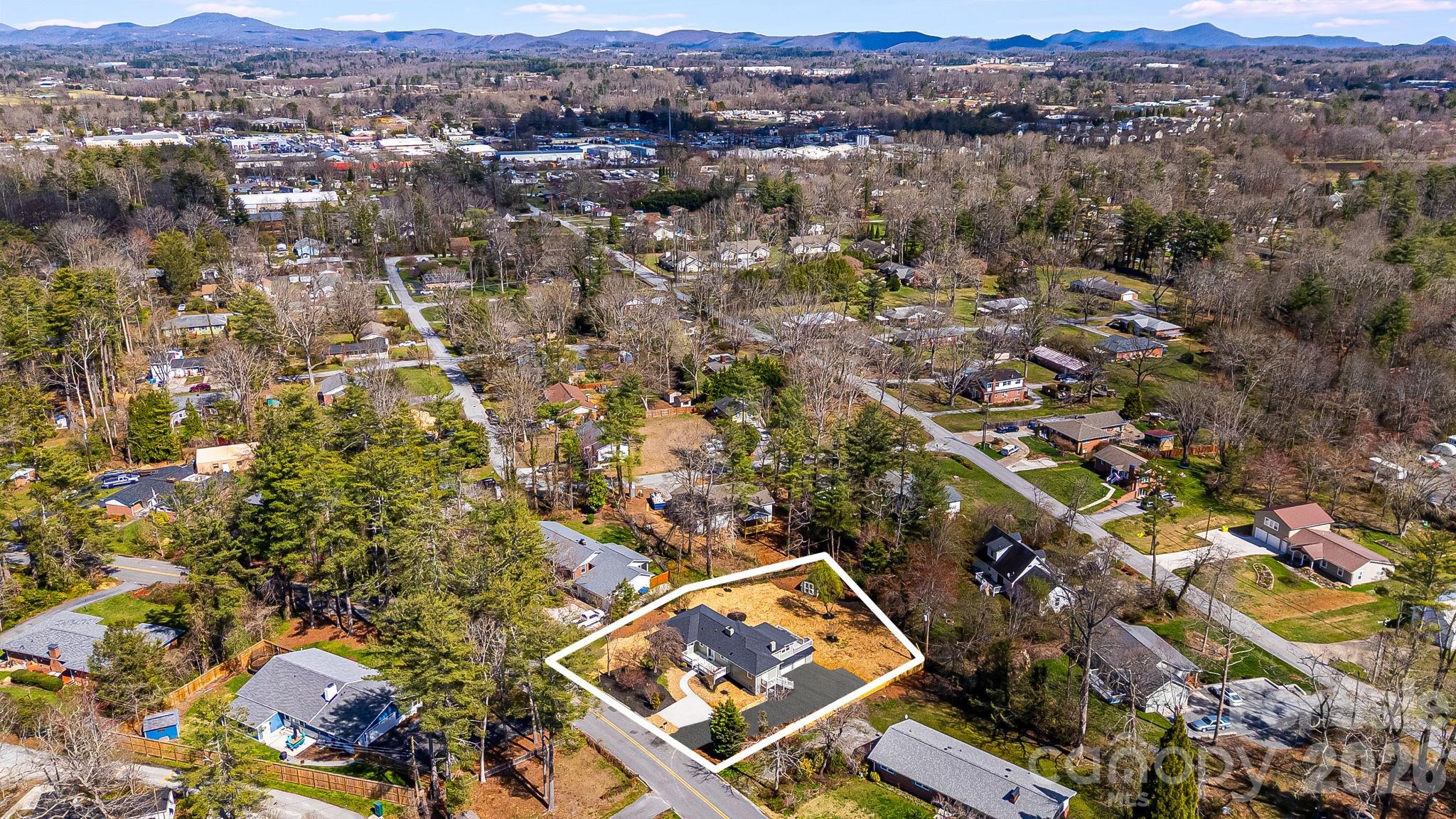 107 Balsam Road Hendersonville, NC 28792 - Photo 40 of 44 an aerial view of residential house with parking space