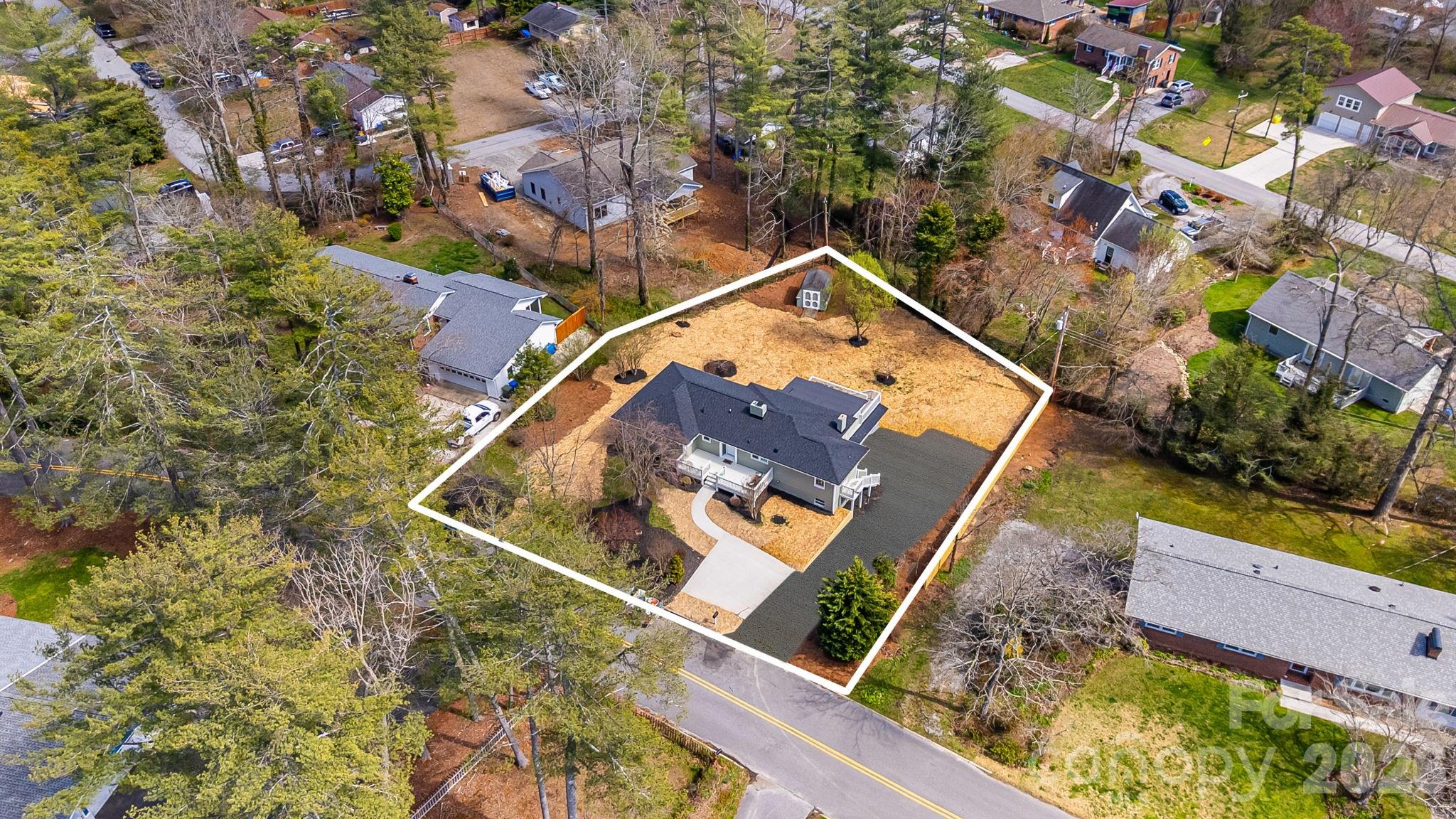 107 Balsam Road Hendersonville, NC 28792 - Photo 41 of 44 an aerial view of house with a yard