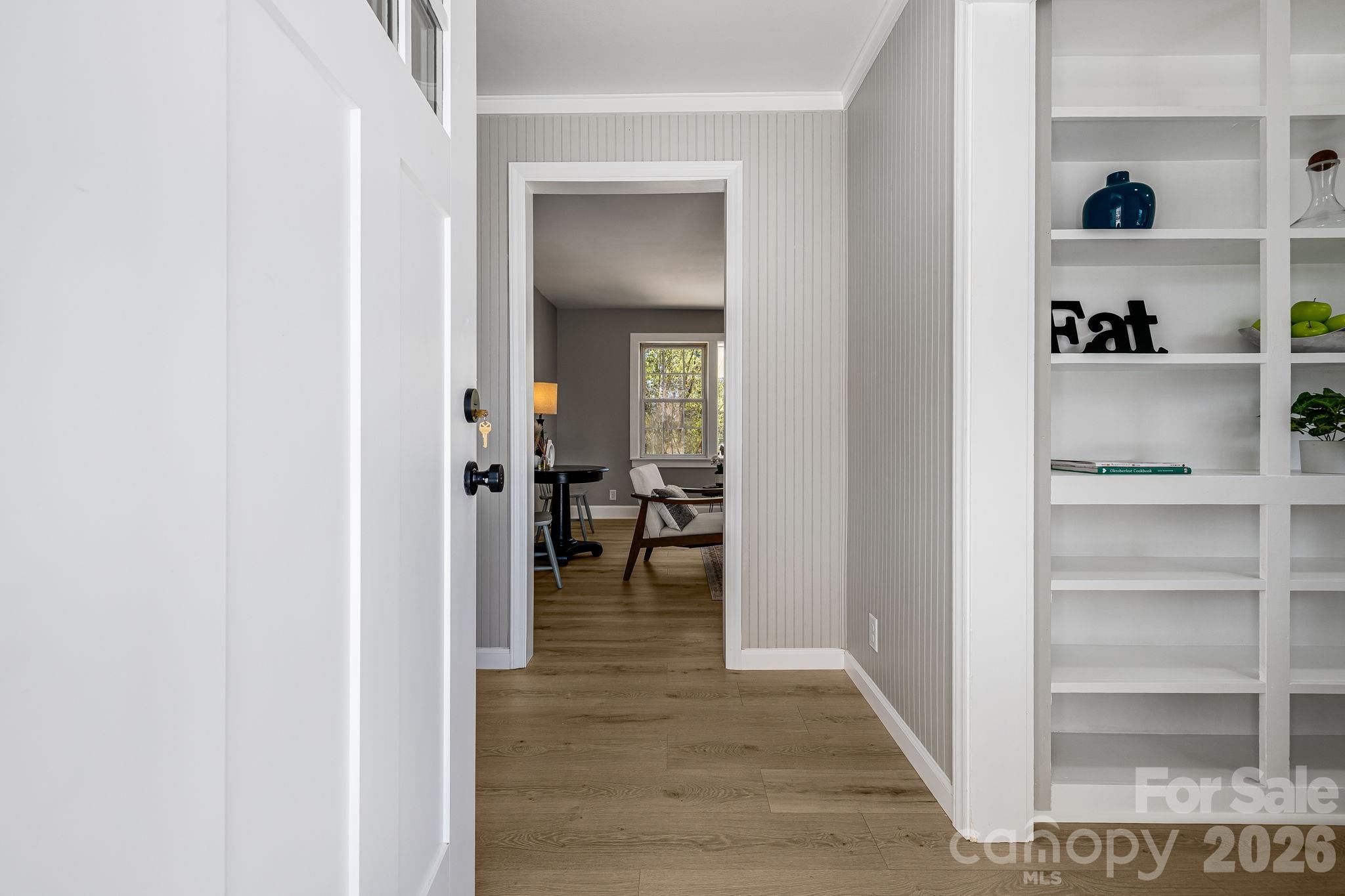 107 Balsam Road Hendersonville, NC 28792 - Photo 5 of 44 a view of a hallway with wooden shelves